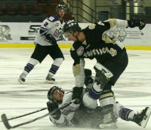 Pontiacs defenceman Alex Grill-Donovan takes out a Steel player at the blue line, as part of the Pontiacs&#8217; first win of the season last Tuesday night.