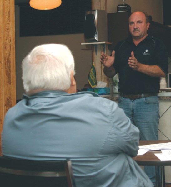 Walter Czuroski, a spokesperson for the Minnie Lake Conservation Society, addresses a crowd of 30 at the Glendon Curling Club on Thursday.