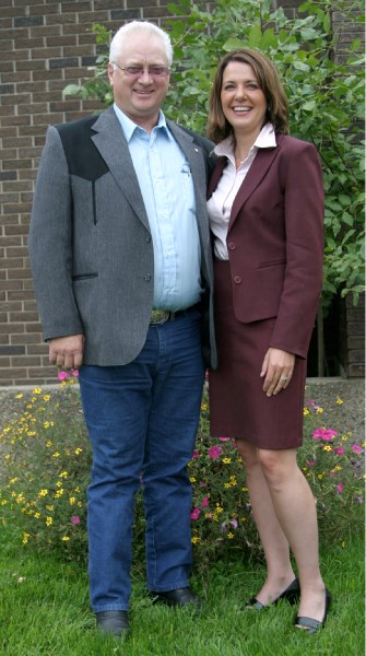 Chuck Farrer stands with Wildrose Alliance leader Danielle Smith outside the Town of Bonnyville office in September.