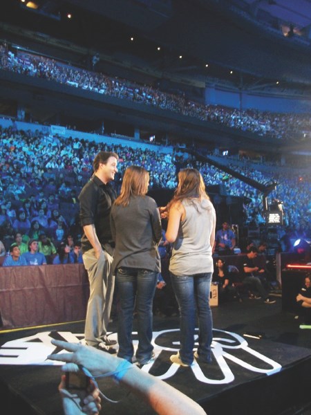 We Day host Ben Mulroney interviews Glendon students Kenidy Aylesworth and Corrie Fritzler at We Day in Vancouver on Oct 15.