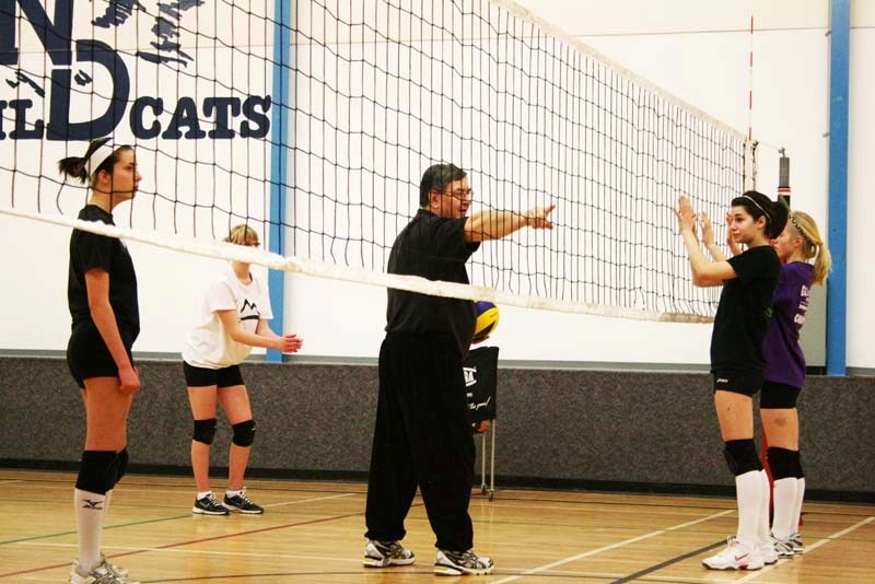 Volleyball coach Dr. Lorne Sawula gives directions to the Sharks U16 players, who listen on intently. Players from both the U16 and U18 club teams attended the volleyball