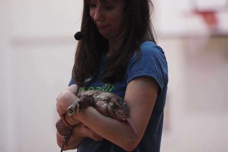 Laura Huculak, Earth Ranger and wildlife biologist, introduces Crimson the tegu to students at Duclos Elementary School on Oct. 15