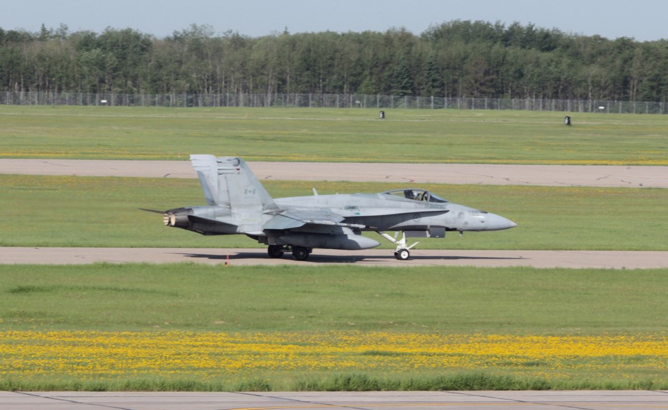 A Canadian fighter pilot takes off in his CF-18 Hornet during a Maple Flag training exercise at 4-Wing Cold Lake.