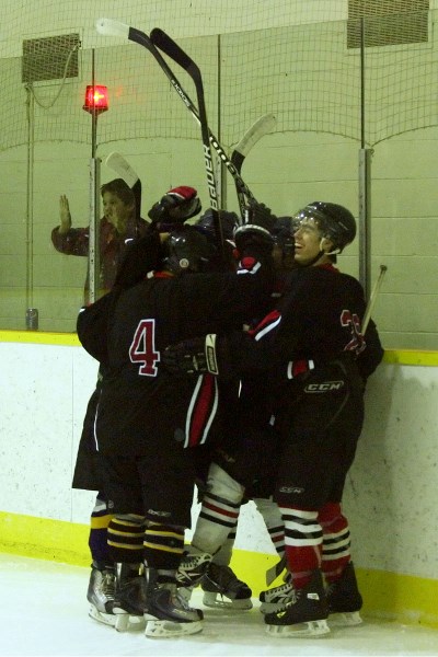 The Saddle Lake Warriors celebrate its fifth goal during the third period of the team&#8217;s game against the Cold Lake Ice on Sunday evening. The Warriors lost by a score