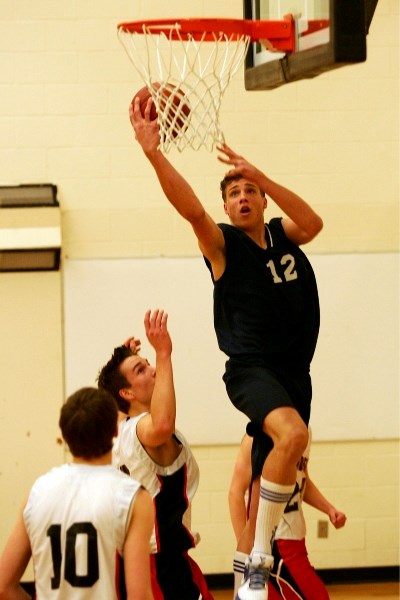 The Lac La Biche Jaws boys&#8217; basketball team take on the Vermilion Marauders during one of the 2010 Tazmania basketball games at St. Paul Regional High School on Friday