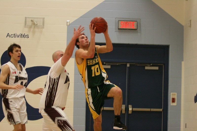 Glendon School centre Colton Witwicky drives the ball to the basket on a Jan. 7 game of the Charity Cup tournament in Cold Lake. Glendon&#8217;s senior high basketball team