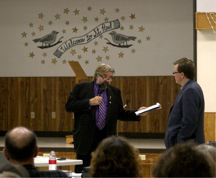 Minister of Infrastructure Ray Danyluk (left) and lawyer Keith Wilson square off at the St. Paul Senior Citizens Centre over provincial laws on March 7.