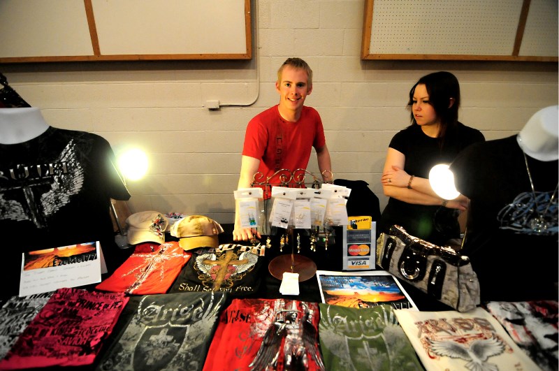 Aaron and Erica Clark sell merchandise at the St. Paul Home and Business Shopping Event at the Rec Centre on Saturday. The Clarks own and operate Ezekiel 77, a local clothing 