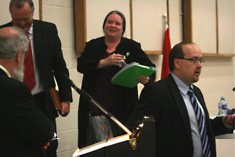 Candidates leave the hot seat after the election forum at the St. Paul Rec Centre on Wednesday. From left: moderator Marvin Bjornstad, Liberal candidate Rob Fox, Green