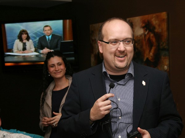 MP Brian Storseth celebrates his re-election with supporters at the St. Paul Golf Club last night, including his wife Amel (left).