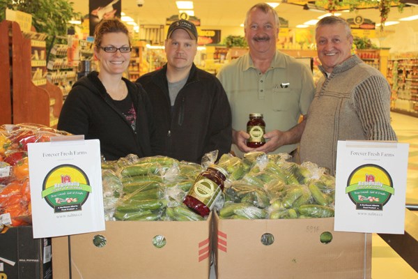 The brand displayed on the sign is a guarantee that the product is grown and manufactured in the Lakeland area. Jerry and Nicole Repka grow vegetables in a greenhouse near