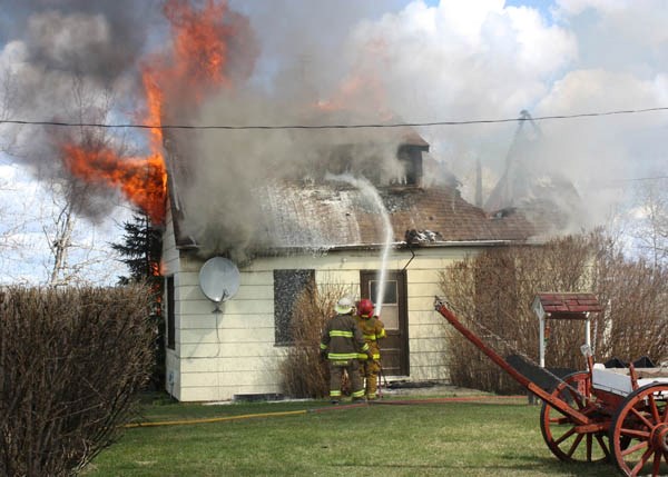 Ashmont firefighers arrived at home of Ken and Gladys Marsh to find the home already fully involved and had to fight the fire mostly from the outside.