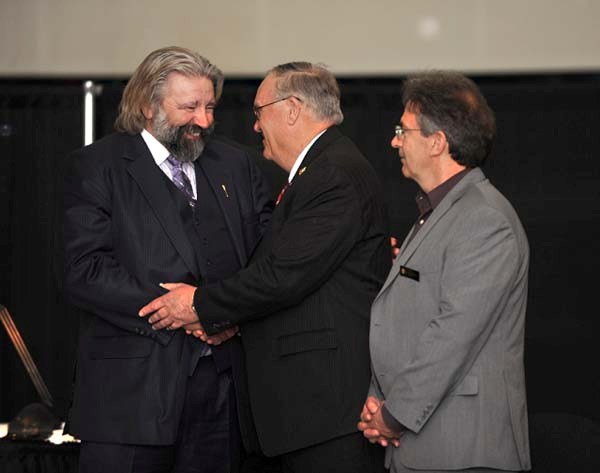 Minister Ray Danyluk receives the elected community leader award from Lt.-Gov. Donald S. Ethell and ARPA President Terry Welsh in Edmonton on Thursday.