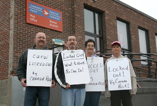 Post office workers locked out by Canada Post continued walking the picket line in St. Paul on Monday. From left: Camille Boulinne, Maurice Richard, Marie Anne Mahe and Doris 