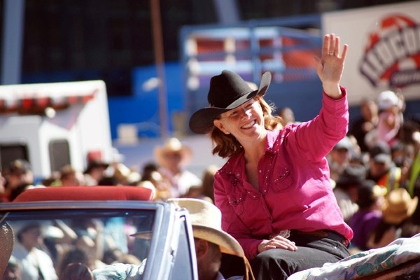 Alison Redford rides in the Calgary Stampede parade.