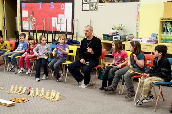 Hubert Landry teaches Elementary students at Mallaig School how to play the spoons.