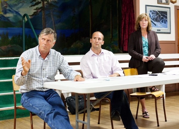 Reeve Steve Upham, engineer Matt Brassard and CAO Sheila Kitz listen to Lottie Lake residents and answer questions about the water system at a meeting last Thursday night.