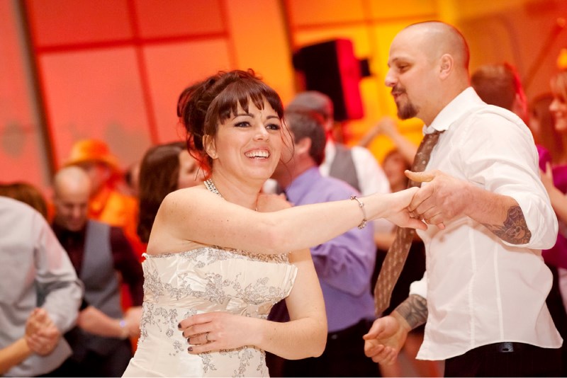 Dana Smyl and her husband Ryan take to the dance floor in their formal wedding attire during the Rock the Dress gala on Saturday night, while Brett Kissel offers