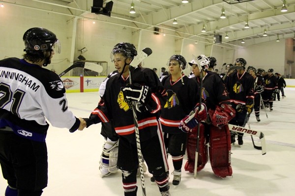 Barry Partridge and the Saddle Lake Warriors shake hands with the Cold Lake Ice after being eliminated from the post season on Saturday night.