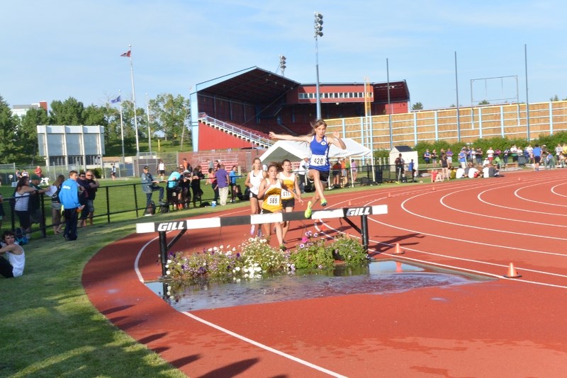 Nicole Kitt leads the pack in the 2,000m steeplechase event at the Western Canadian Championships in Calgary on July 28.