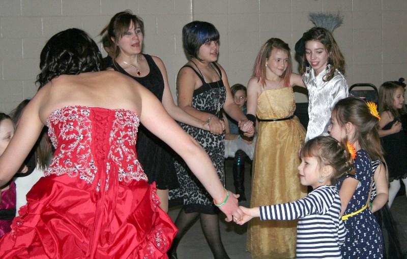 Guests and beneficiaries at the New Year&#8217;s Eve Benefit Dance dance to the sounds of the Torpedoes, a musical group from St. Paul, Lac La Biche, and Derwent, at the Rec. 