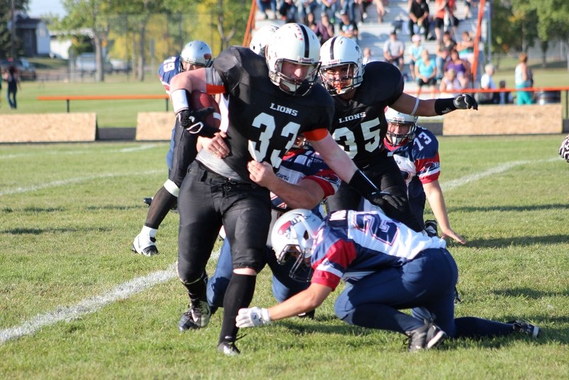 Dylon Machura marches the ball downfield during a 2013 regular season match up with the St. Paul Lions. Machura was recently named to the University of Alberta Golden Bears