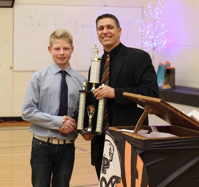 Parker Lumby accepts the Bengals&#8217; Most Valuable Player award from head coach Todd Tanasichuk.