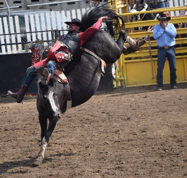 Steven DeWolfe earned the buckle for bareback riding on Sunday with an impressive ride. He looked completely happy and at ease on the back of that bucking horse.