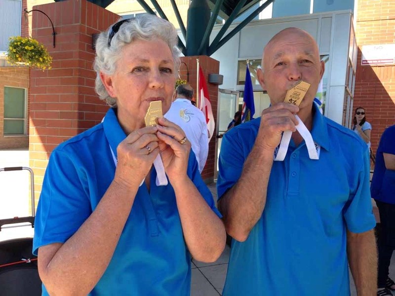 Monica Oosthuizen and Bill Hall followed in the footsteps of many champions before them by giving their gold medals a kiss upon receiving them on July 18 at Strathmore High