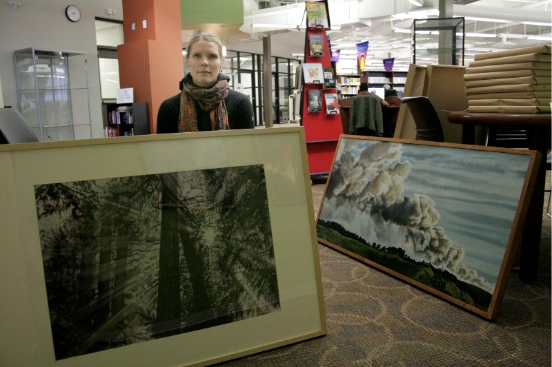 Jenna Latham&#8217;s paintings share her experinces as a firefighter. The drawings and paitings are on display at the Stuart MacPherson Library.