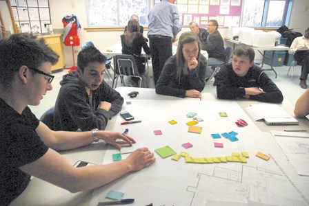 Students, parents, staff and Stantec officials worked together to come up with some planning options for the new high school at the Bold Center. From left to right, Bruce