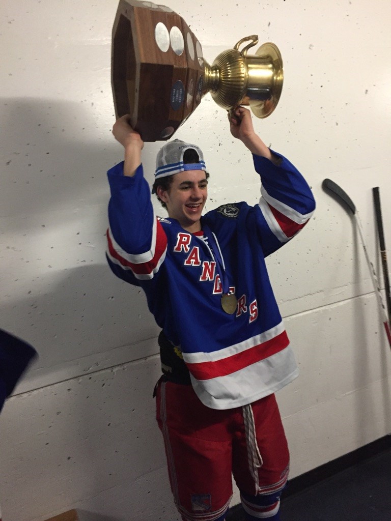 Lac La Biche&#8217;s Sami Fyith hoists the Alberta provincial bantam AAA trophy last week after his Fort Saskatchewan Rangers team prepared to play in Saskatchewan this week