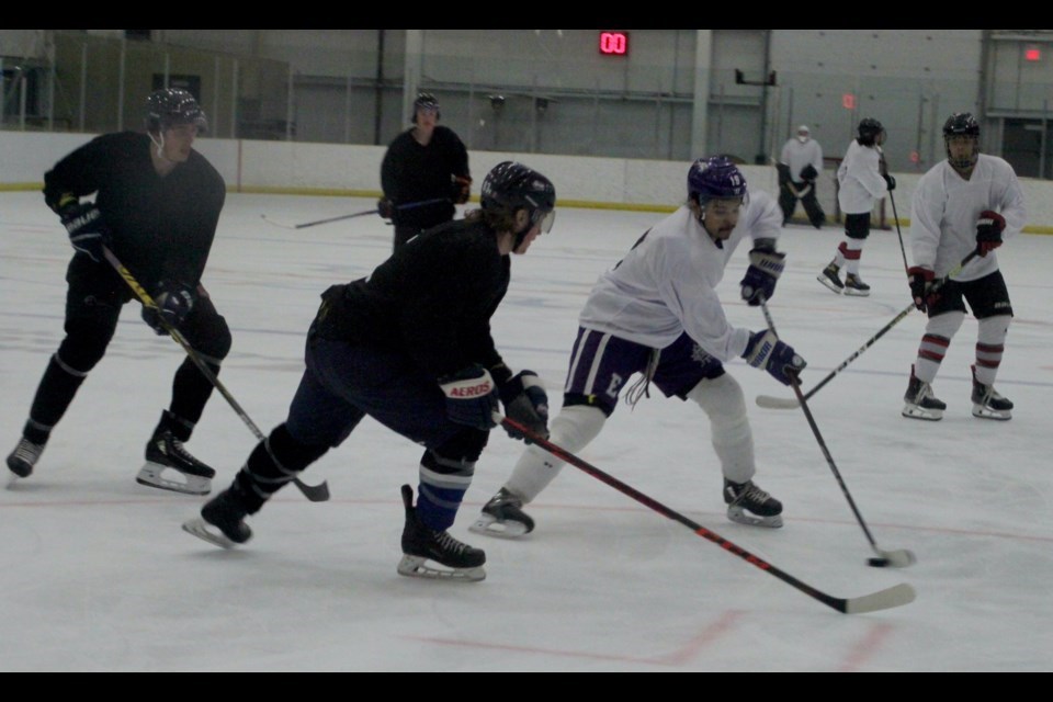 Parker Scobey, a 16-year-old 6'1 225-pound forward from Daysland Alberta,
attempts to intercept Jason Monias (white jersey) during the Lac La Biche Lakers training camp that took place from May 11-12. In June, Scobey was signed as a member of the roster for the 2024-2025 season. Chris McGarry photo. 