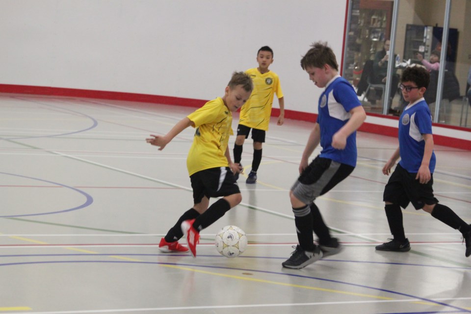 Members of the Lac La Biche FC U11 boys play against oneo f the U11 boys teams from St. Paul during the recent Lakeland District Soccer Association league play, which took place from Dec. 9-10 at the Bold Centre. Chris McGarry photo. 