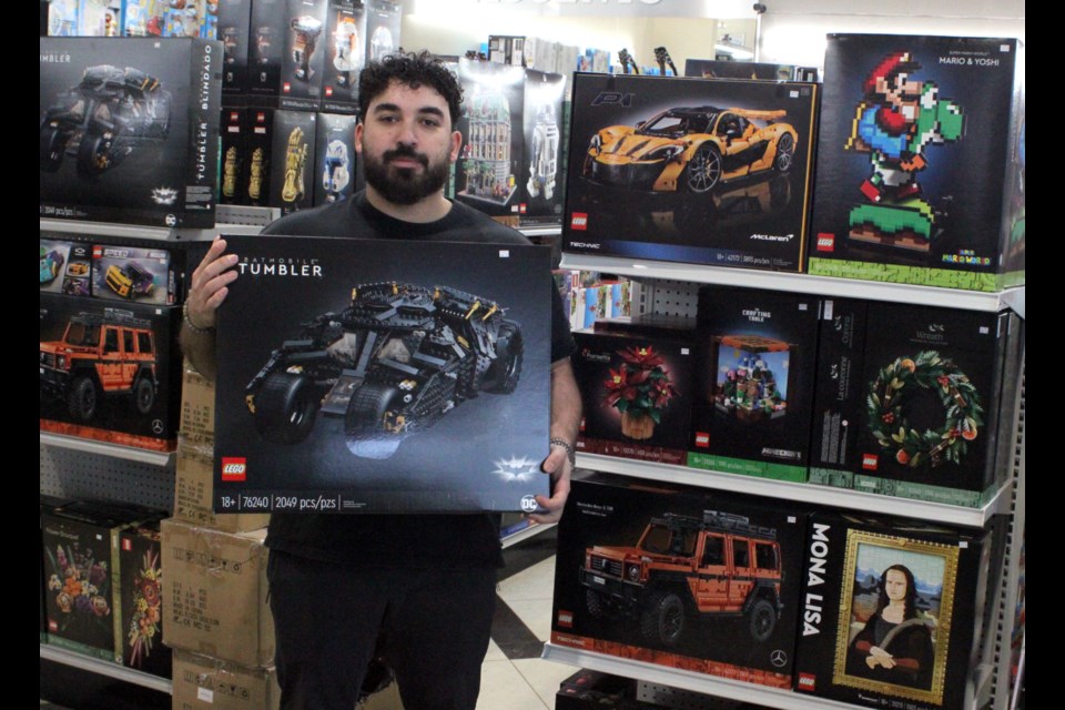 Marwan Smaiel of Smiley’s in Lac La Biche holds a Lego set. Legos, along with some other popular brands of toys, have been big sellers at the department store as folks purchase gifts for Christmas. Chris McGarry photo. 