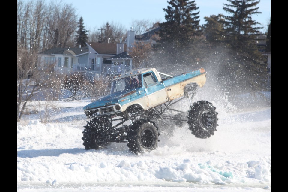 A monster truck kicks up snow and ice as it tears through the racecourse on Lac La Biche Lake. Chris McGarry photo. 