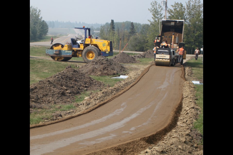 Construction crews working on the Mission Road walking trail extension project on Saturday, Sept. 7. Chris McGarry photo. 