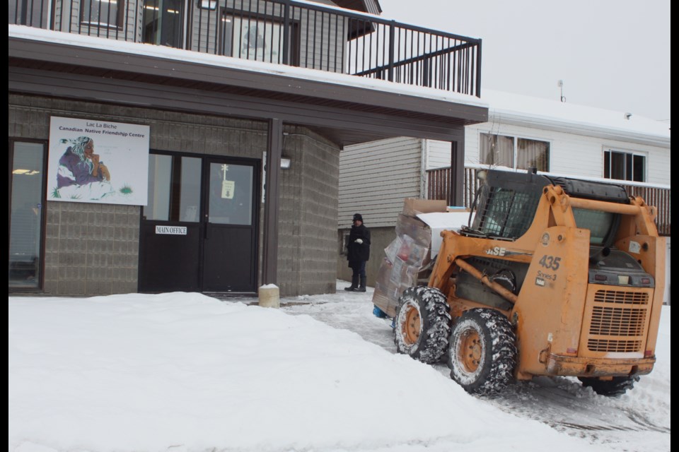 Khalil Abougouche delivers a palette of groceries via forklift to the friendship centre. Chris McGarry photo. Chris McGarry photo. 