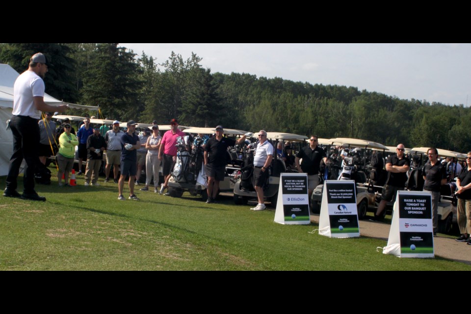 Lac La Biche Mayor Paul Reutov speaks to golfers at the start of the recent Healthier Communities golf fundraiser in Lac La Biche.