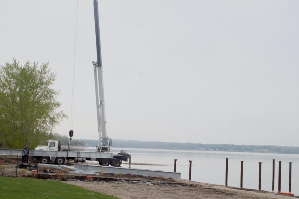 Contractors working on the new McArthur Park pier on Thursday, May 16. Chris McGarry photo. 