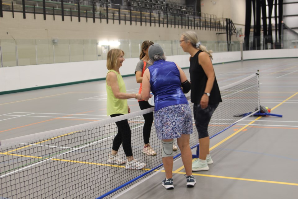 Sharron Chaulk (blue), Annette Hogan (yellow), and Lara Bate (black), all members of the Cold Lake Pickleball Club attended the drop in for seniors week.