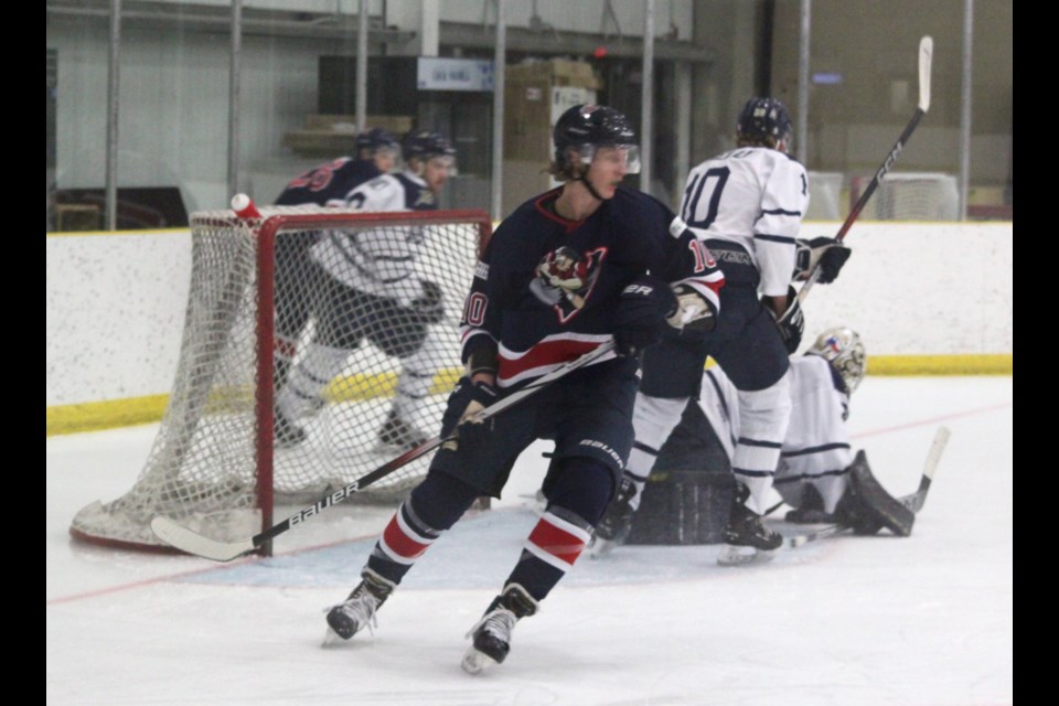 Portage College Voyageurs forward Isaak Watters skates away after an unsuccessful attempt to score on the Briercrest College Clippers’ net. The Clippers were the winners of the 4-2 contest, which took place at the Bold Center on Friday, Nov. 15. Chris McGarry photo. 