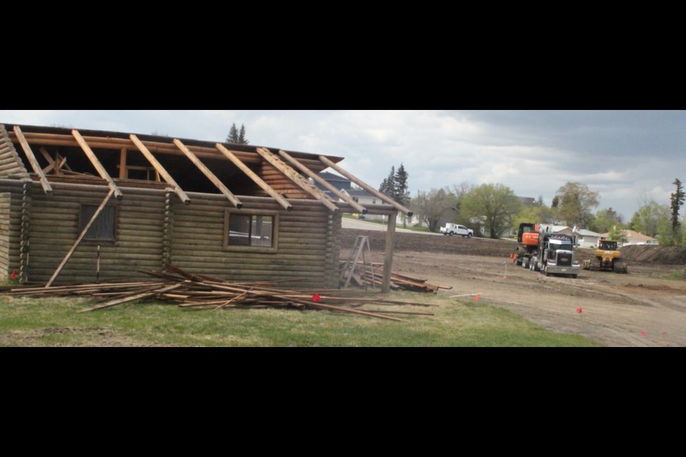 The pow wow hut, which is owned by Robert Rayko and is being removed by his brother, Allan Rayko, is being taken apart in preparation to be moved to another location. Chris McGarry photo. 