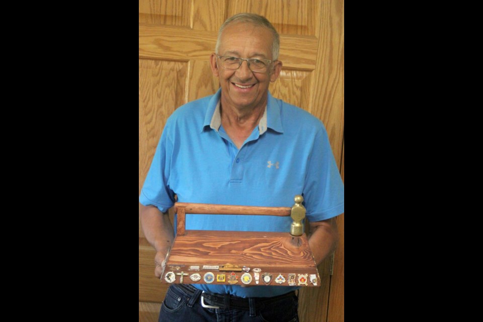 Rene Schaub, president of the Lakeland Archers, holds a trophy he received during the 2024 Canadian Outdoor Archery Championships, which took place in Fredericton, New Brunswick from Aug. 2-10. The trophy is given to the province that will host the national archery competition the following year. The Lakeland Archers will be hosting the event in Lac La Biche from Aug. 1-10, 2025. Chris McGarry photo. 