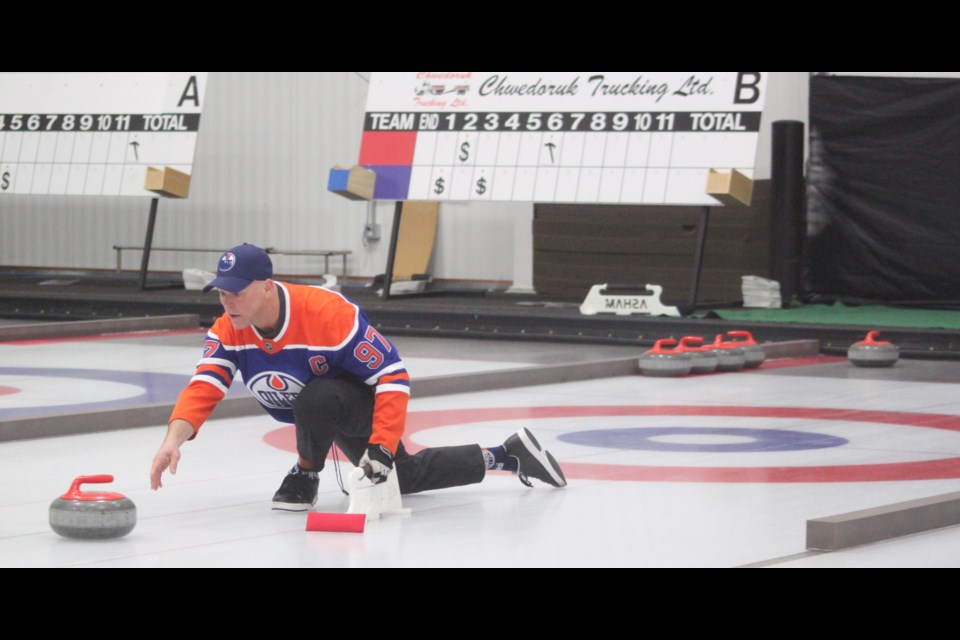 Richard Bourassa focuses as he lets go of the rock during a game at the 2025 Men’s Curling Spiel, which took place at the Lac La Biche and District Curling Club on Saturday, Jan. 18. Chris McGarry photo. 