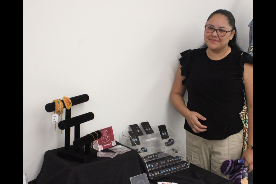 Sabrina Cardinal, a second-year student in the Native Arts program at Portage College, stands with some of the handcrafted items she had on display and for sale at the Christmas Art Sale, which took place at the Lac La Biche campus on Friday, Dec. 6. Chris McGarry photo.