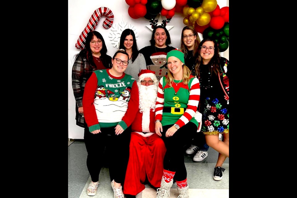 Members of the Lac La Biche Kinette Club during annual Santa photos. In photo, back, from left to right: Renee Richard, Annette Nortje, Kyla Robb, and Natalie Hanas. 
Front row, left-right: Lauren Kamke, Kelsey Kitt, and Kristen Shewchuk Submitted photo. 