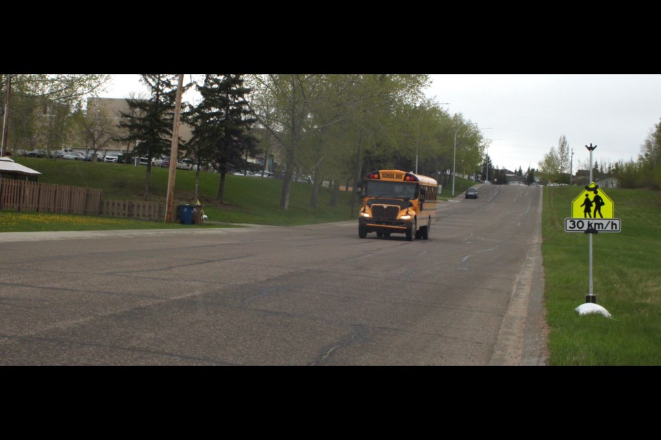 School zone signs are in place on 91 Ave. next to Portage College, which has been serving as a temporary location for Grade 4-12 students from Ecole Plamondon to have their classes while the school building is being repaired. Chris McGarry photos. 