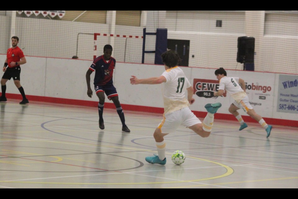 Seun-bira (Jesse) Oladejo of the Portage College Voyageurs obstructs Lakeland College Rustlers center back Jonah Elliott as he attacks the Portage College zone. The meeting between the two Alberta Colleges Athletic Conference (ACAC) futsal squads resulted in a 4-1 victory for Lakeland. The game took place on Friday, Jan. 17 as part of the opening matches of the 2025 ACAC Futsal North Regional, which was hosted by Portage College and held at Lac La Biche’s Bold Center from Jan. 17-19. Chris McGarry photo. 