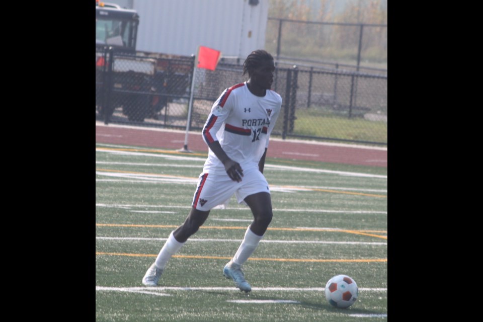 Seun-bira Oladejo prepares to kick the ball into the field. Chris McGarry photo. 